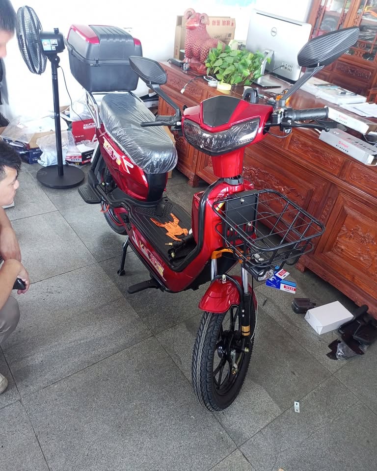 Red TTA utility electric bike with front basket